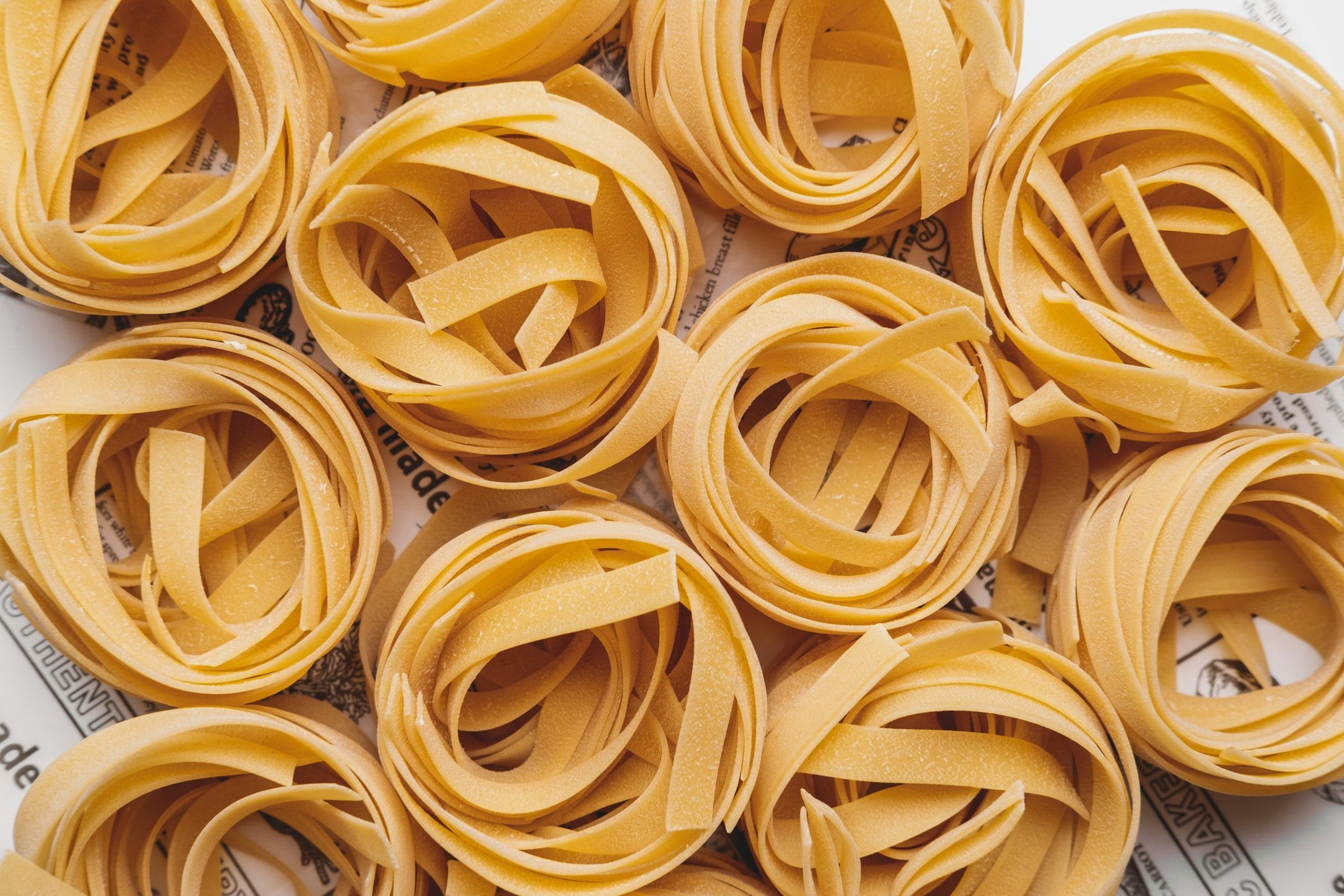 Freshly rolled pasta noodles on the counter